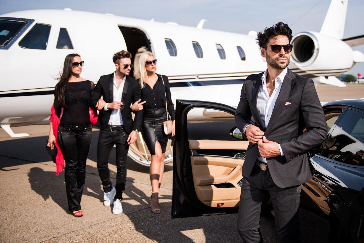 Airport transfer — passengers at private jet with chauffeur
